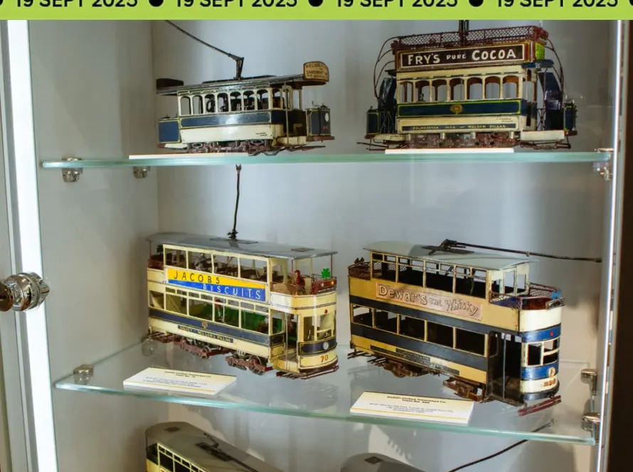 Glass display case with detailed vintage model trams, each featuring colorful signage, under a Culture Night banner with the date 19 Sept 2025 repeated along the top.