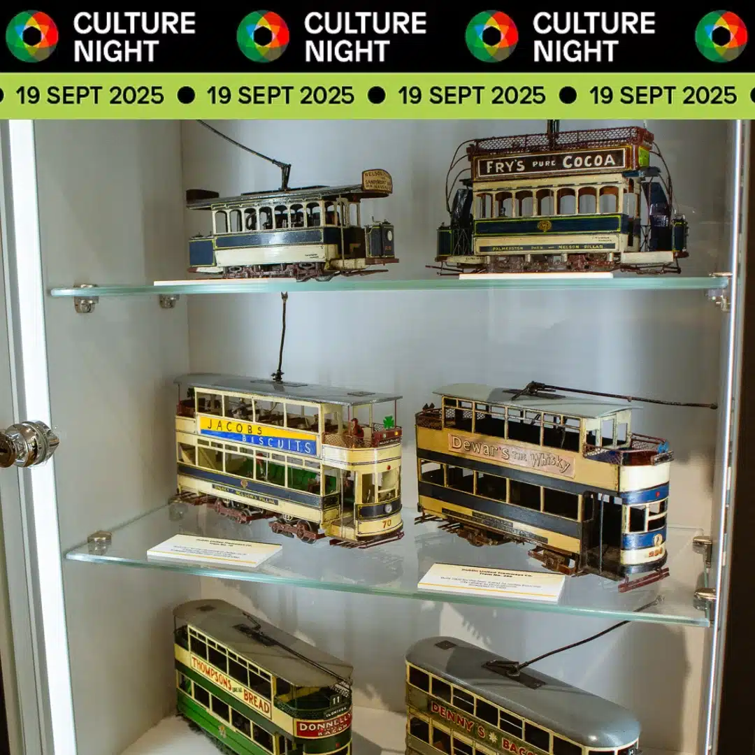 Glass display case with detailed vintage model trams, each featuring colorful signage, under a Culture Night banner with the date 19 Sept 2025 repeated along the top.