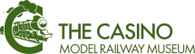 Logo of The Casino Model Railway Museum featuring a stylized green locomotive with text in green font next to it.